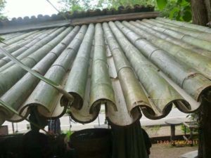Halved bamboo roofing clums